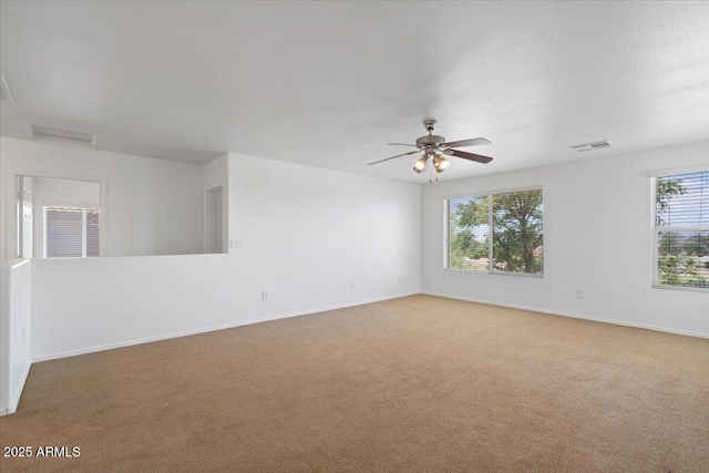 180 S 18th St, Coolidge, AZ 85128 - empty room featuring light colored carpet, baseboards, and a ceiling fan