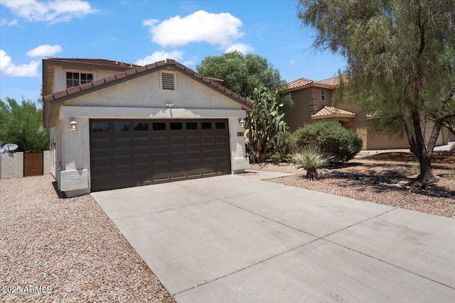 180 S 18th St, Coolidge, AZ 85128 - mediterranean / spanish home with stucco siding, driveway, a garage, and a tiled roof