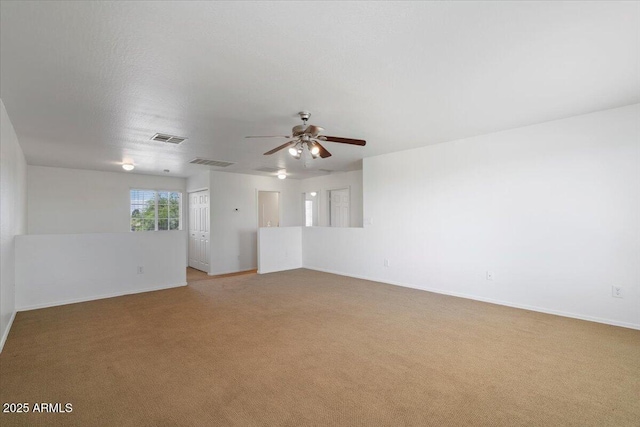 180 S 18th St, Coolidge, AZ 85128 - unfurnished room with light colored carpet, a ceiling fan, and baseboards