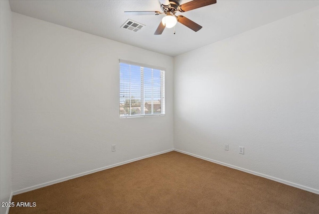 180 S 18th St, Coolidge, AZ 85128 - empty room featuring carpet, a ceiling fan, and baseboards