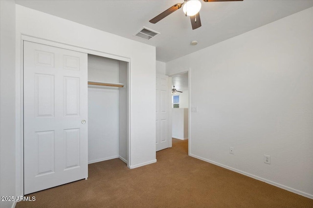 180 S 18th St, Coolidge, AZ 85128 - unfurnished bedroom with carpet, a closet, baseboards, and a ceiling fan