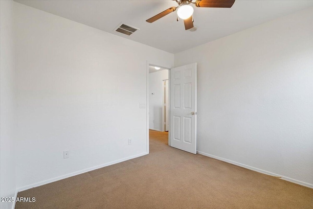 180 S 18th St, Coolidge, AZ 85128 - empty room featuring ceiling fan, light colored carpet, and baseboards