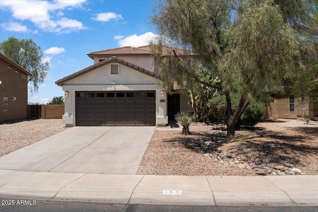 180 S 18th St, Coolidge, AZ 85128 - view of front of house with driveway, a garage, stucco siding, and a tiled roof