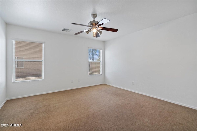 180 S 18th St, Coolidge, AZ 85128 - carpeted spare room with a ceiling fan and baseboards