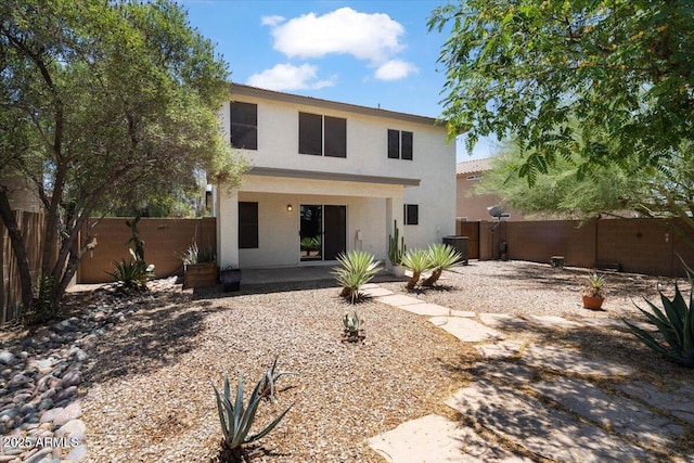 180 S 18th St, Coolidge, AZ 85128 - rear view of house featuring stucco siding, a patio, and a fenced backyard