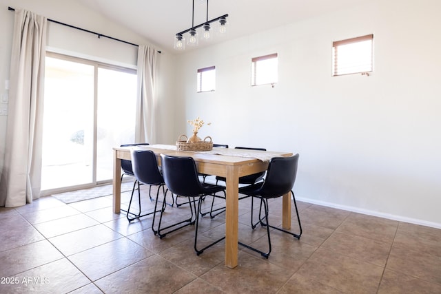 dining room featuring baseboards and tile patterned floors