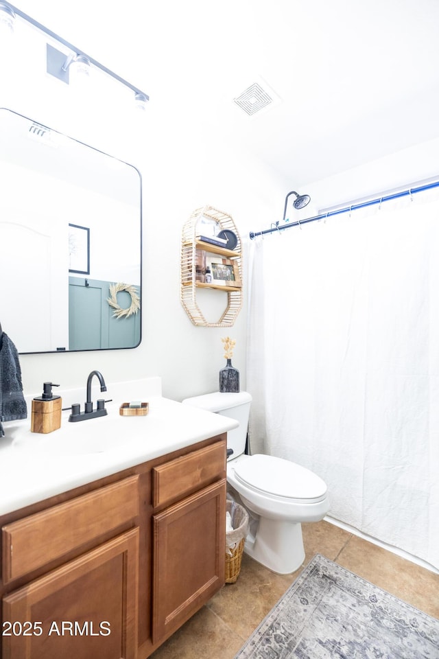 bathroom featuring curtained shower, tile patterned flooring, toilet, vanity, and visible vents