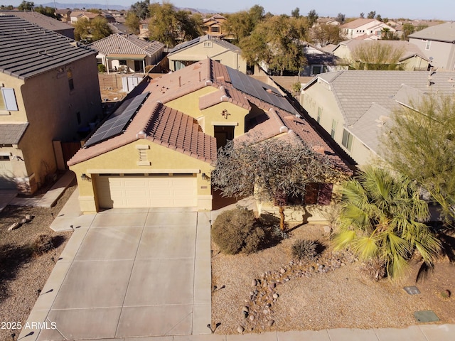 birds eye view of property with a residential view