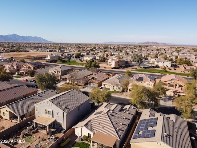 birds eye view of property featuring a mountain view and a residential view