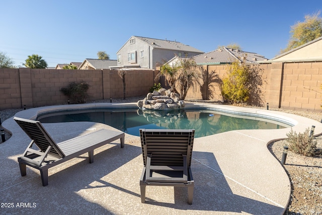 view of pool with a patio area, a fenced backyard, and a fenced in pool