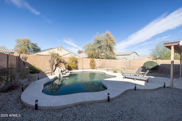 view of swimming pool with a patio area, a fenced backyard, and a fenced in pool