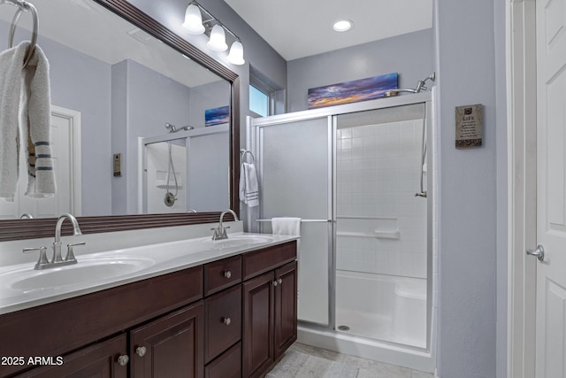 bathroom featuring an enclosed shower and vanity