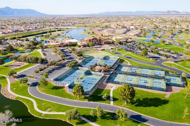 drone / aerial view with a residential view and a water and mountain view