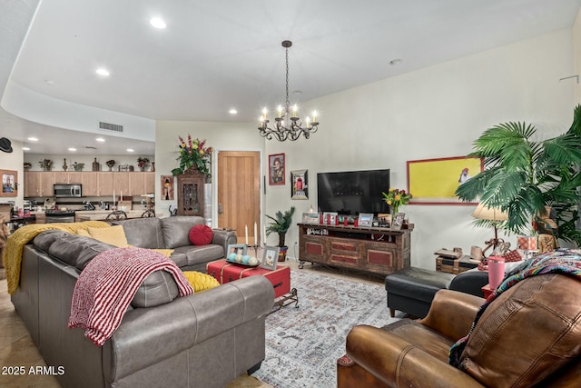 living room featuring an inviting chandelier, visible vents, and recessed lighting