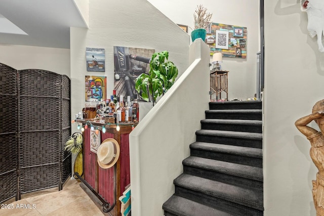 staircase with tile patterned flooring