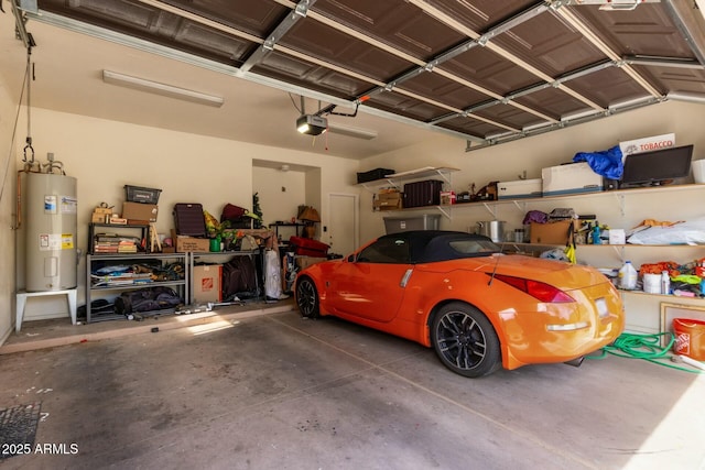 garage featuring water heater and a garage door opener