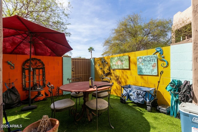 view of patio / terrace featuring fence