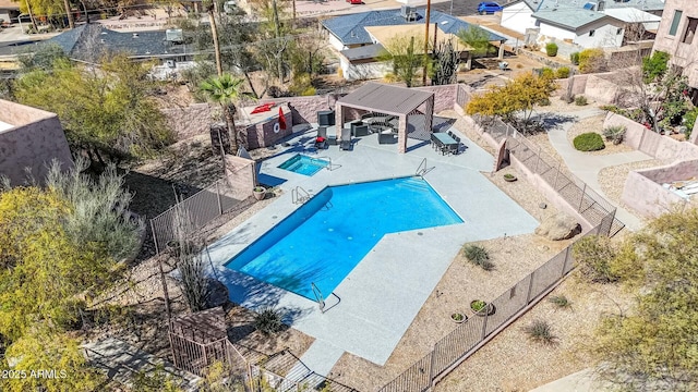 pool featuring a gazebo, a patio area, and a fenced backyard