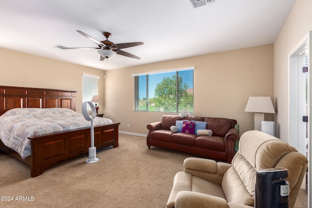 bedroom featuring ceiling fan and light carpet