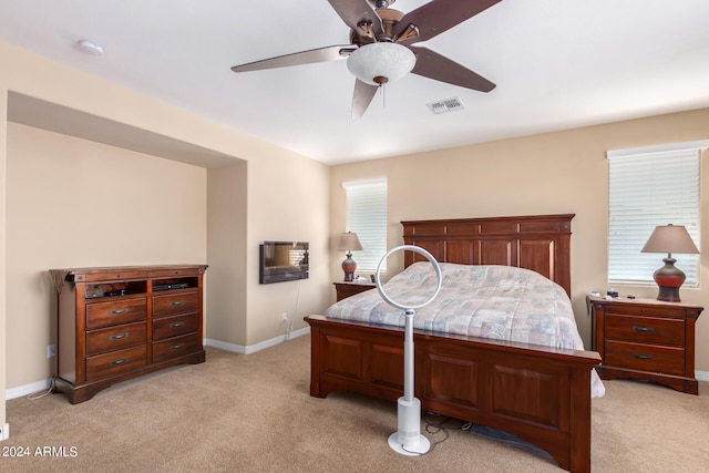 bedroom featuring ceiling fan and light colored carpet