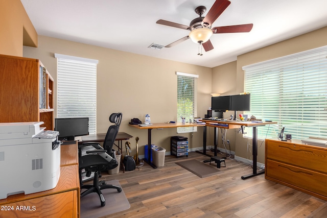 home office with ceiling fan and hardwood / wood-style flooring