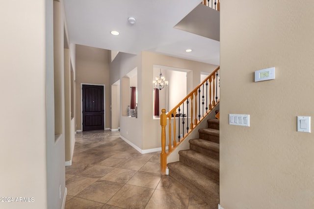 entryway featuring an inviting chandelier