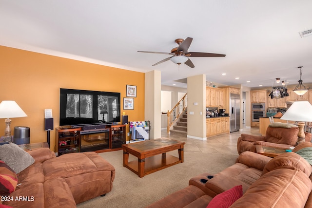 tiled living room featuring ceiling fan