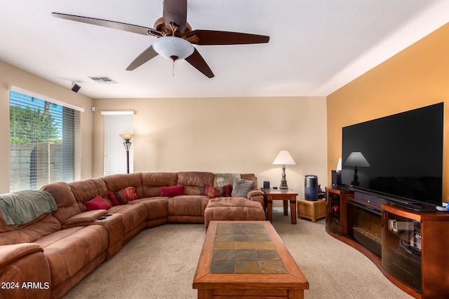 living room featuring light carpet and ceiling fan