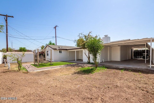 rear view of house with a carport