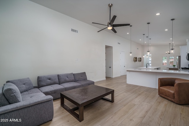 2345 N 28th Pl, Phoenix, AZ 85008 - living area with ceiling fan, light wood finished floors, recessed lighting, a chandelier, and baseboards