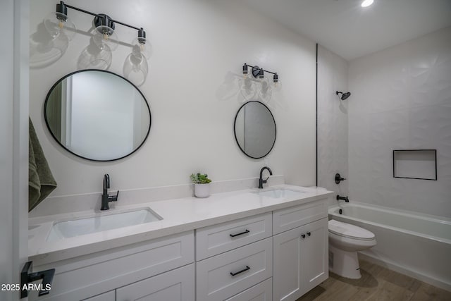 2345 N 28th Pl, Phoenix, AZ 85008 - full bath with toilet, double vanity, bathtub / shower combination, and wood finished floors