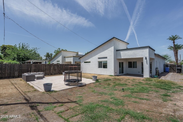 2345 N 28th Pl, Phoenix, AZ 85008 - rear view of property with a patio, a fenced backyard, stucco siding, and an outdoor living space
