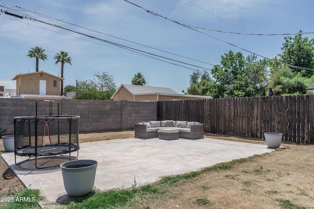 2345 N 28th Pl, Phoenix, AZ 85008 - fenced backyard featuring a trampoline, a patio, and outdoor lounge area