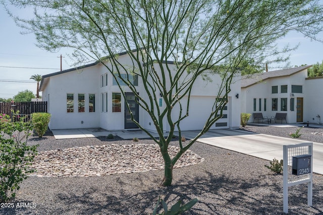 2345 N 28th Pl, Phoenix, AZ 85008 - view of front of property featuring driveway, stucco siding, and an attached garage