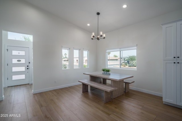 2345 N 28th Pl, Phoenix, AZ 85008 - dining area with a chandelier, recessed lighting, light wood-style floors, baseboards, and high vaulted ceiling