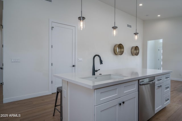 2345 N 28th Pl, Phoenix, AZ 85008 - kitchen with stainless steel dishwasher, a sink, wood finished floors, white cabinetry, and a towering ceiling
