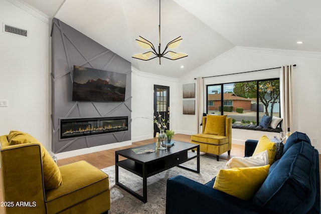 8419 E Rancho Vista Dr, Scottsdale, AZ 85251 - living area featuring vaulted ceiling, wood finished floors, a fireplace, ornamental molding, and visible vents