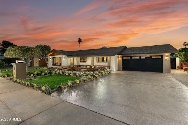 8419 E Rancho Vista Dr, Scottsdale, AZ 85251 - view of front of home with stucco siding, an attached garage, a front yard, and concrete driveway