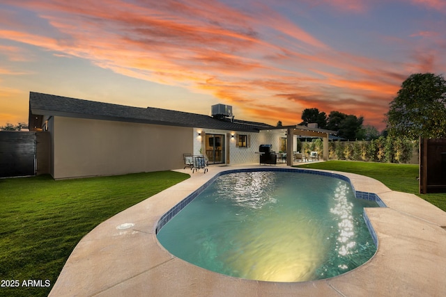 8419 E Rancho Vista Dr, Scottsdale, AZ 85251 - rear view of house with a pergola, a patio area, a lawn, an outdoor pool, and fence