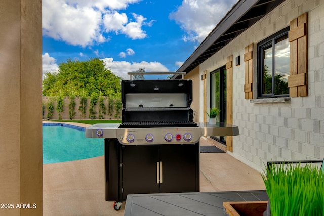 8419 E Rancho Vista Dr, Scottsdale, AZ 85251 - view of patio / terrace with fence, a fenced in pool, and area for grilling