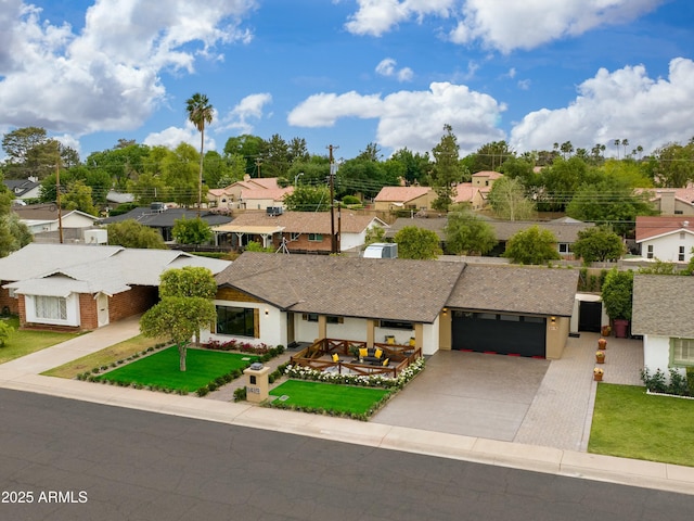 8419 E Rancho Vista Dr, Scottsdale, AZ 85251 - view of front of home with a residential view, an attached garage, driveway, and a front yard