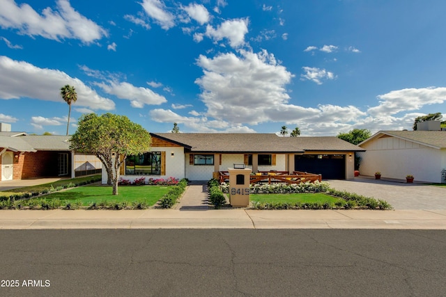 8419 E Rancho Vista Dr, Scottsdale, AZ 85251 - single story home featuring an attached garage, driveway, a front yard, and stucco siding