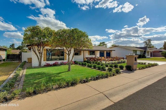 8419 E Rancho Vista Dr, Scottsdale, AZ 85251 - view of front of home with stucco siding, a front lawn, and fence