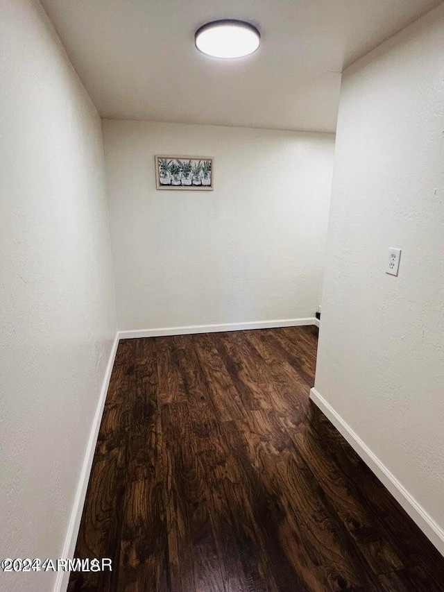 spare room with dark hardwood / wood-style floors