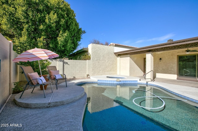 view of swimming pool with an in ground hot tub and a patio area