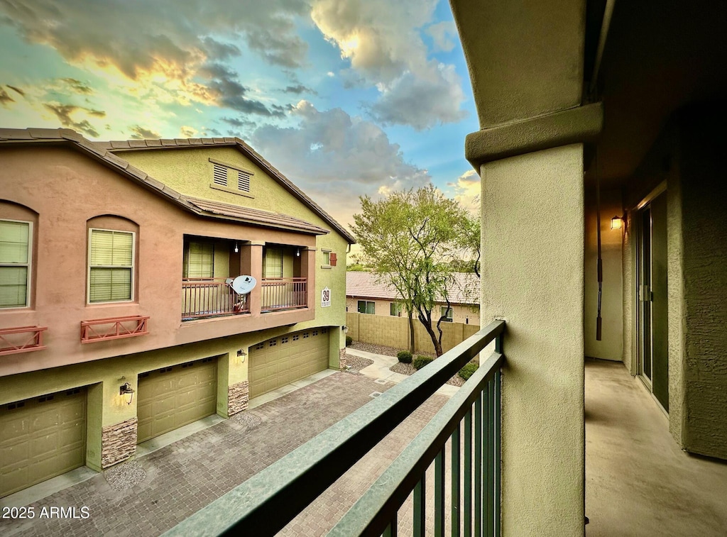 view of balcony at dusk