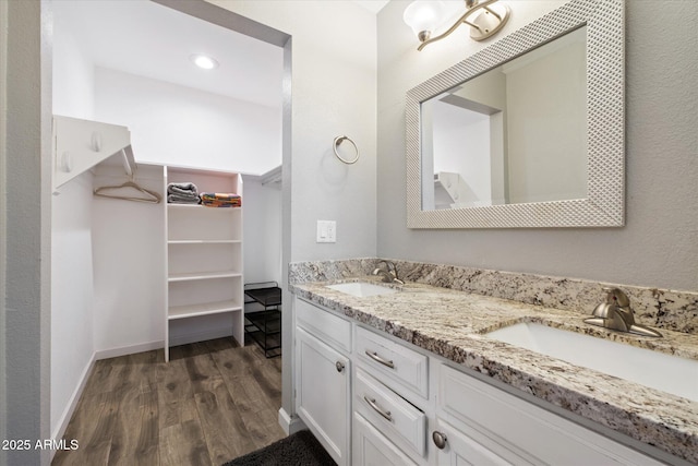 bathroom featuring vanity and hardwood / wood-style floors