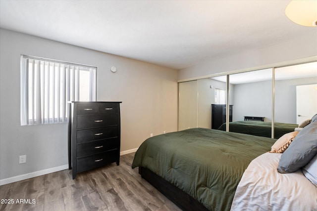 bedroom featuring a closet and light hardwood / wood-style flooring