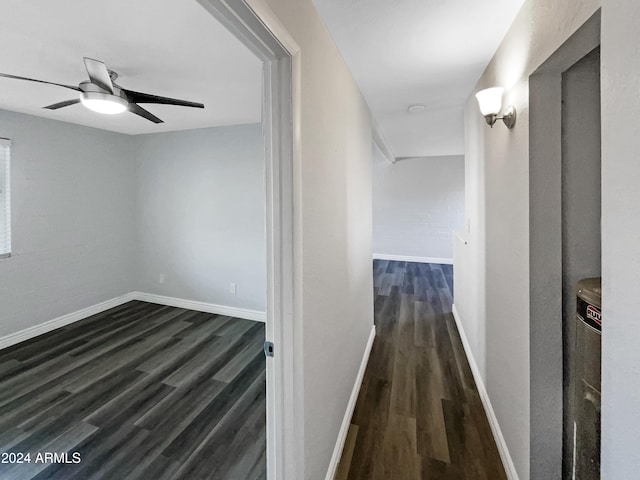 corridor featuring dark hardwood / wood-style floors