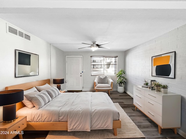 bedroom with dark wood-type flooring and ceiling fan